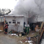 Firefighter - smoke coming out of manufactured home